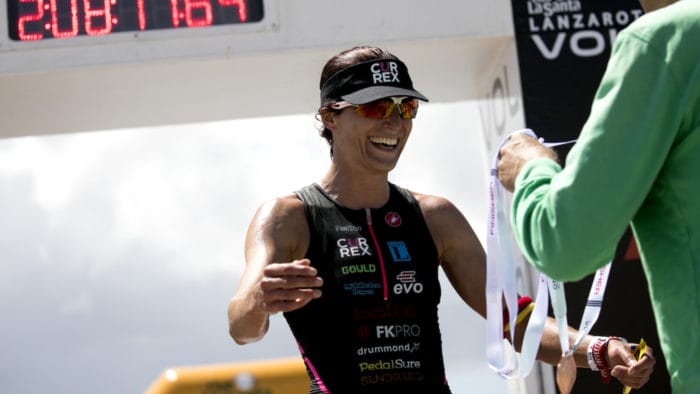 Alice Hector receives her medal from Volcano Triathlon Race Director Kenneth Gasque