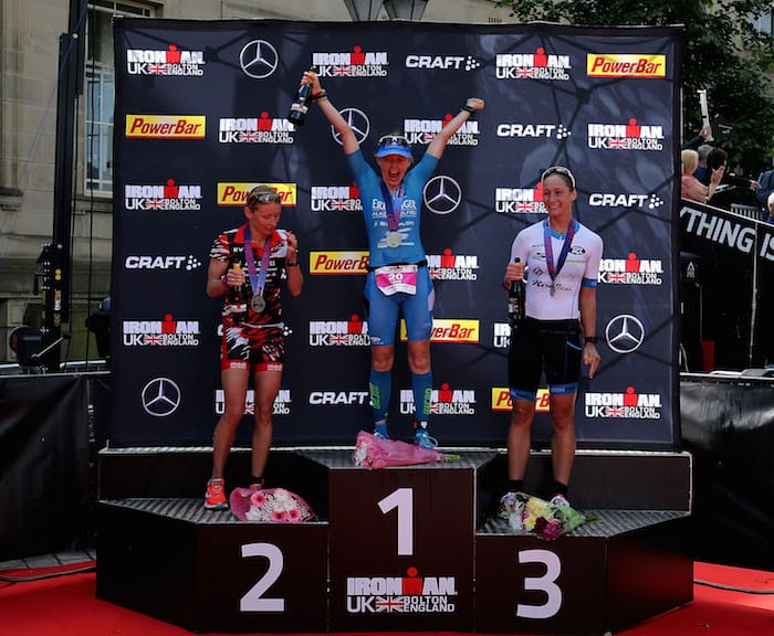 BOLTON, ENGLAND - JULY 16: Lucy Gossage of Britain (C) celebrates winning the women's race at Ironman UK with Diana Riesler of Germany (L) second and Nikki Bartlett of Britain (R) third on July 16, 2017 in Bolton, England. (Photo by Nigel Roddis/Getty Images for Ironman)