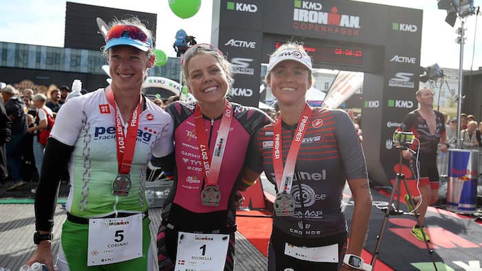 COPENHAGEN, DENMARK - AUGUST 20: Michelle Vesterby (C) of Denmark in 1st position, Corinne Abraham (L) of Great Britain in 2nd position and Christina Svejstrup (R) in 3rd position of Denmark celebrate their results after finishing KMD IRONMAN Copenhagen on August 20, 2017 in Copenhagen, Denmark. (Photo by Nigel Roddis/Getty Images for IRONMAN)