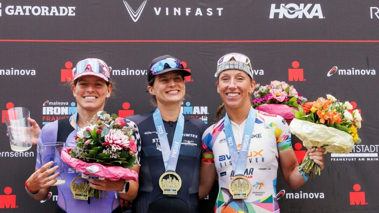 Skye Moench of the United States of America, Sarah True of the United States of America and Agnieszka Jerzyk of Poland pose for a picture during the flower ceremony of the IRONMAN European Championship Frankfurt on July 02, 2023 in Frankfurt am Main, Germany