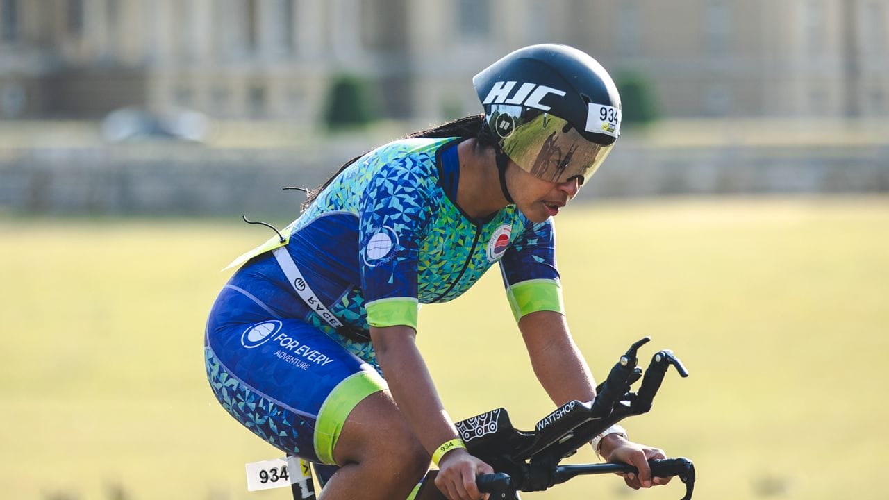Female competitor on the bike at Outlaw Half Holkham