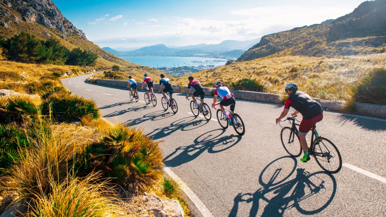 Cyclists descending mountain pass