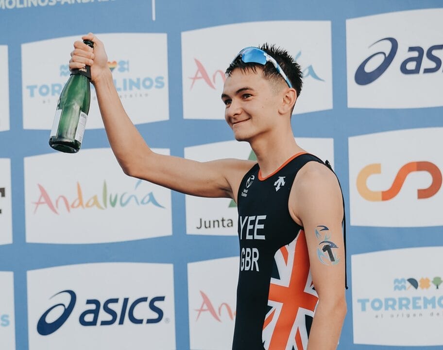 Alex Yee champagne WTCS Grand Final 2024 Torremolinos photo credit World Triathlon