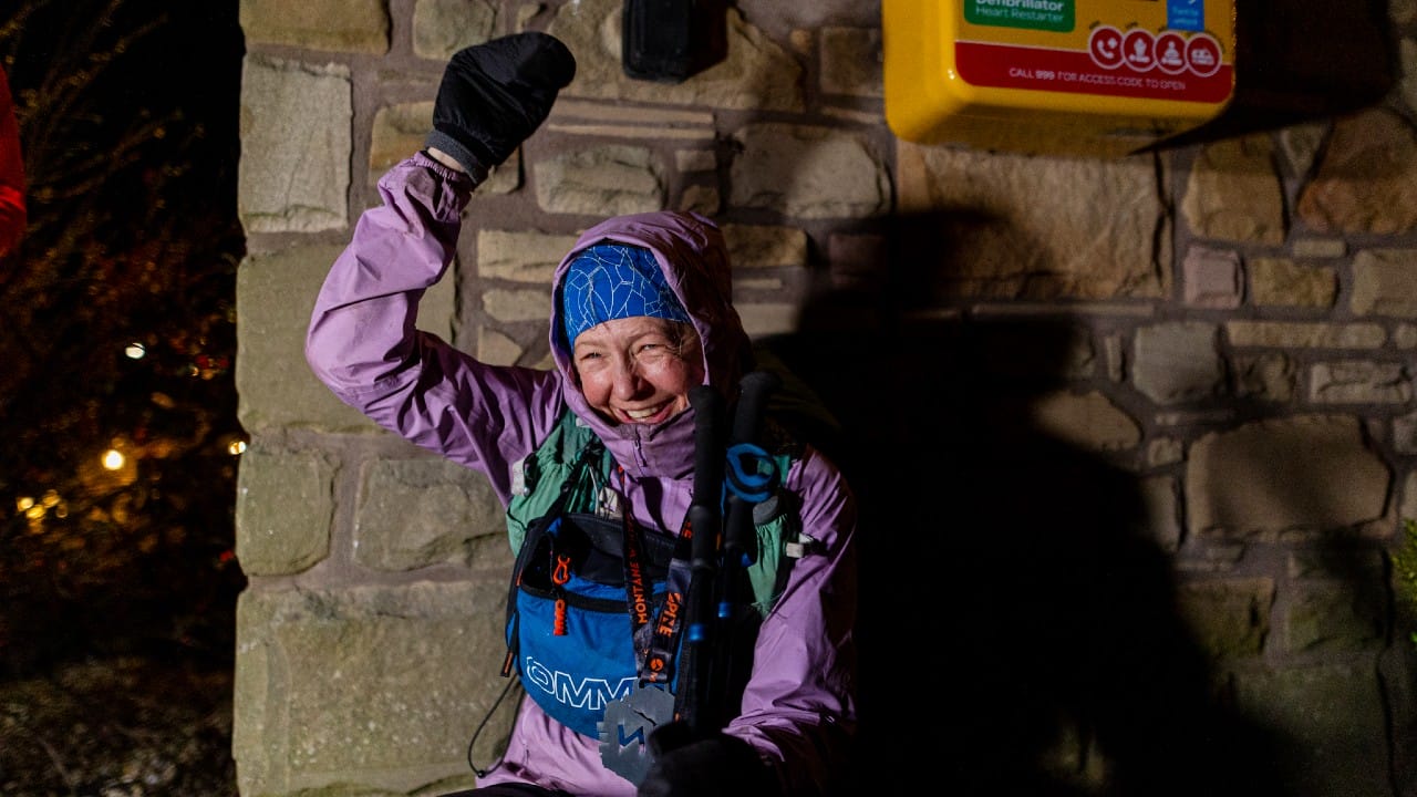 Lucy Gossage finish line wall Montane Winter Spine Race 2025 [Photo credit: Wild Aperture Photography / The Spine Race]