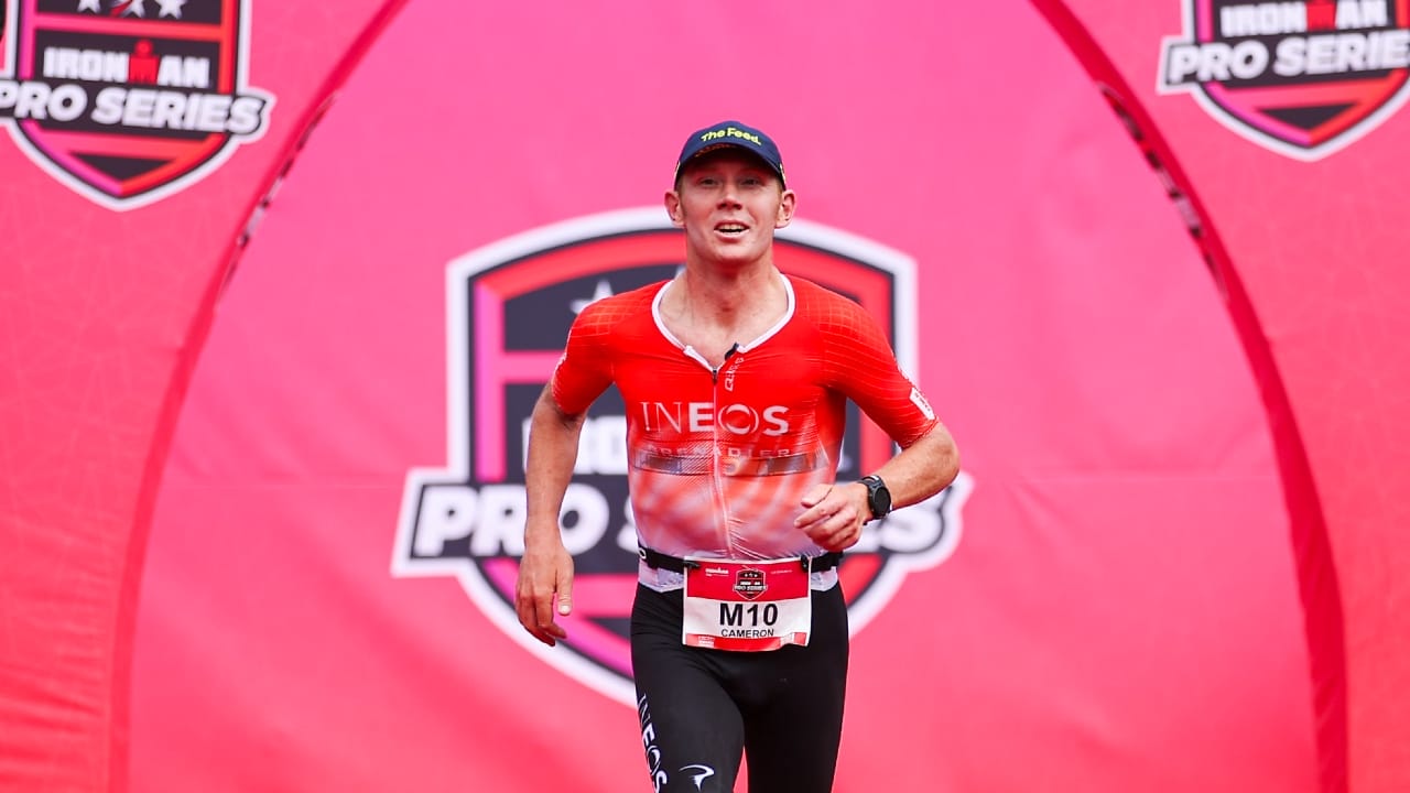 Cam Wurf runs to finish line IRONMAN Pro Series