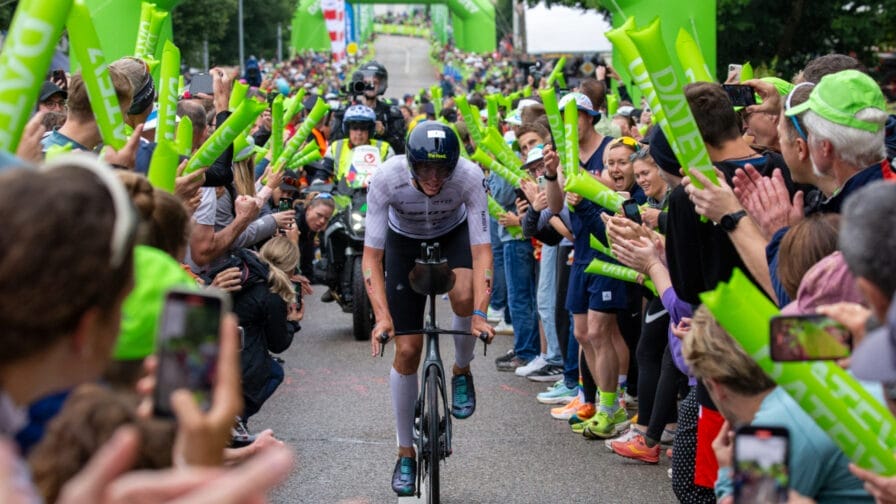 A rider makes his way through the crowds at a busy Challenge Roth.